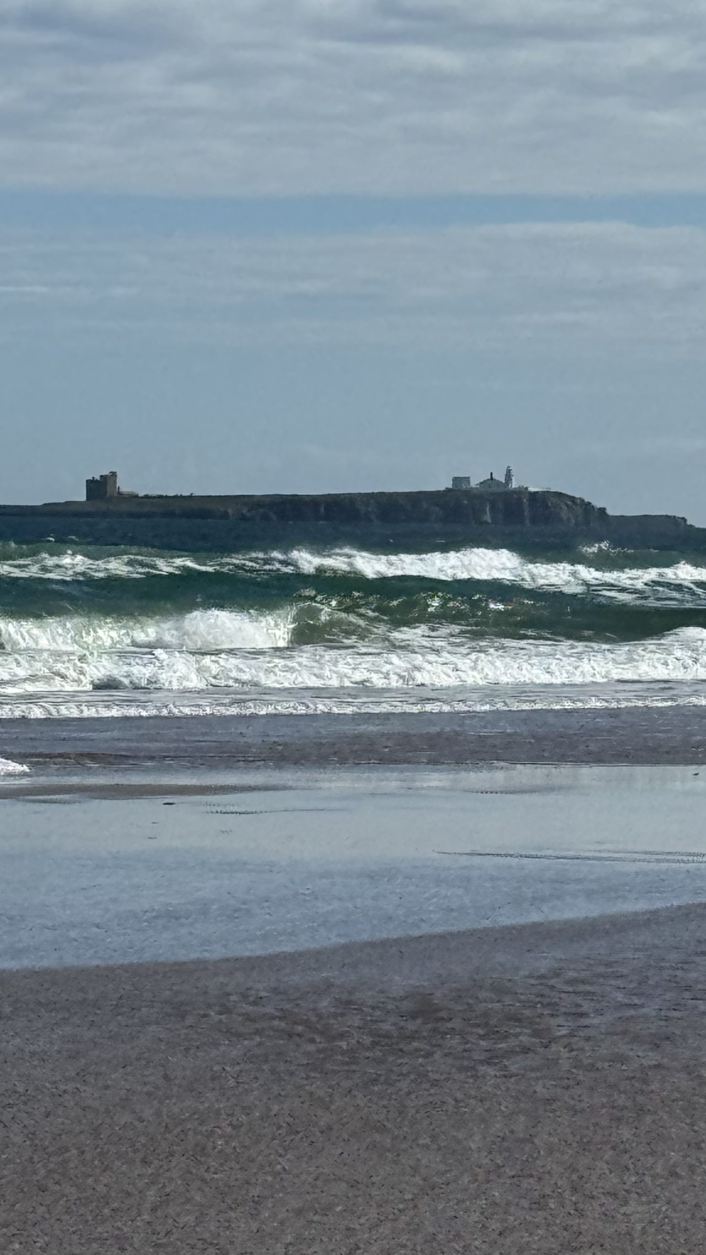 Waves breaking on the sandy shore